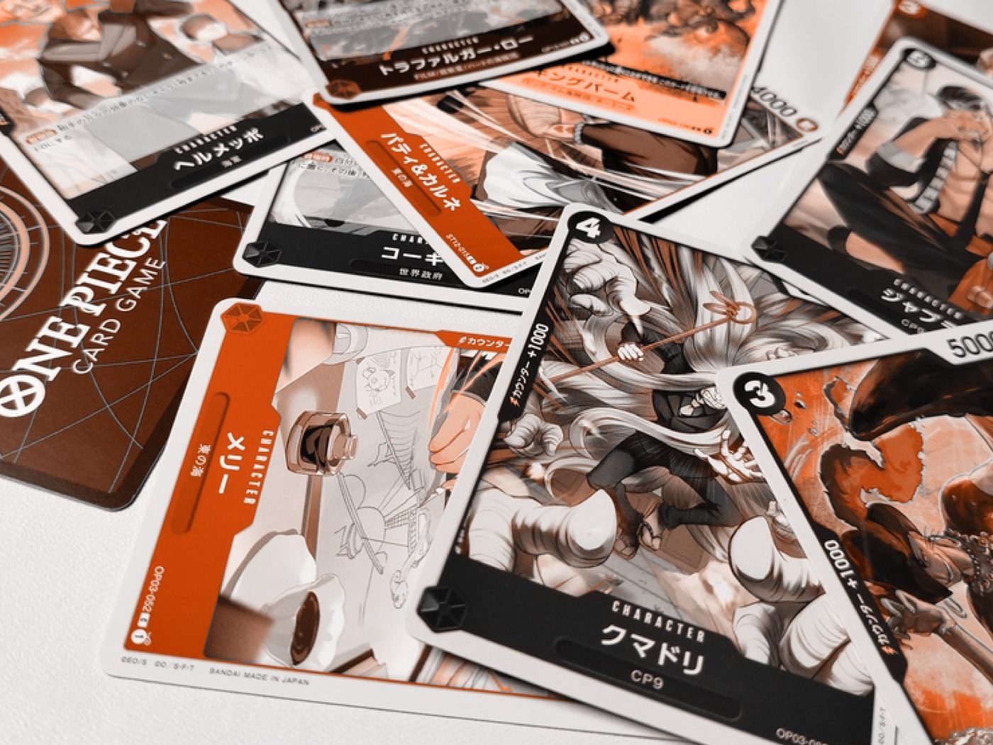 One Piece Card Game collectibles arranged in an editorial composition