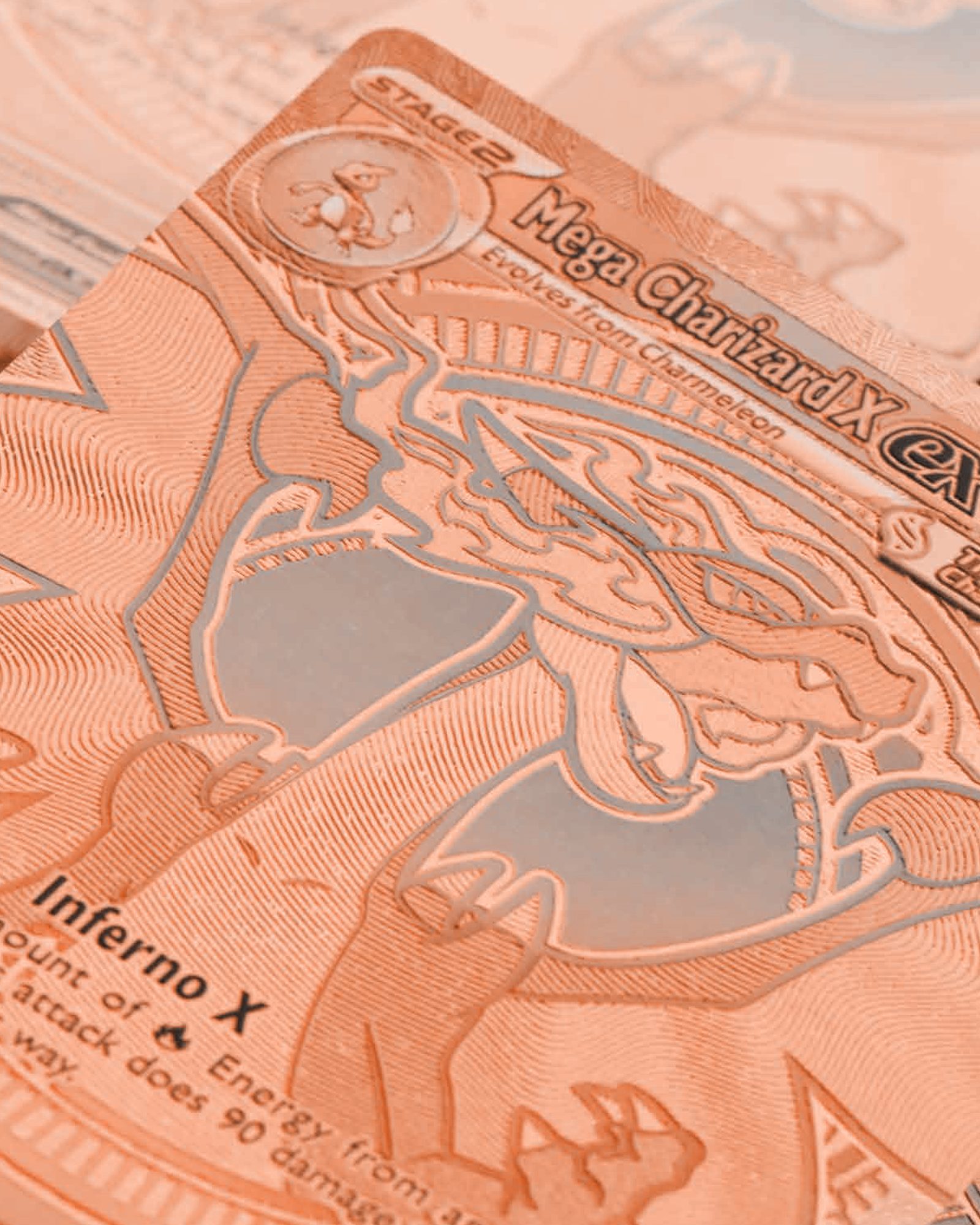 Macro detail of a collectible card etched in copper tone, representative of the Pokémon franchise